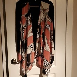 A Komodo Style jacket, silky front panels with soft stretchy arms and back panel